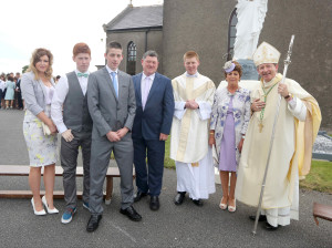 REPRO FREE 19/07/2015; Bishop Alphonsus Cullinan DD, Bishop of Waterford & Lismore, with Rev. Shane O’Neill, Knockanore and newly ordained Priest for the diocese of Waterford and Lismore, and his family, Fiona, Darren, Cathal, Dad; Thomas and Mum; Patricia after Shane's ordination in the Church of The Sacred Heart, Knockanore, Co. Waterford. Picture: John Hennessy
